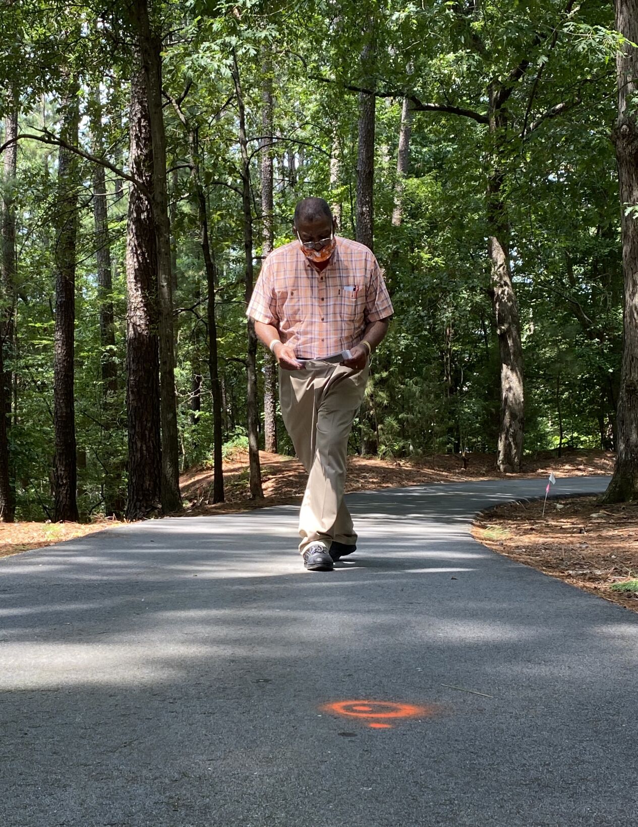 Orange circle marks the spot of laborers graves beneath pavement on Calhoun property